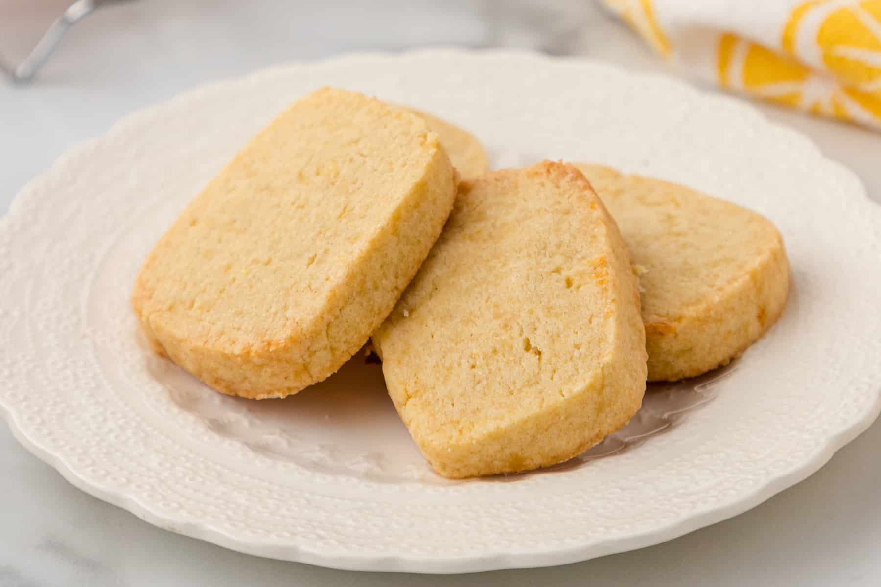 three lemon sugar cookies on a white palte