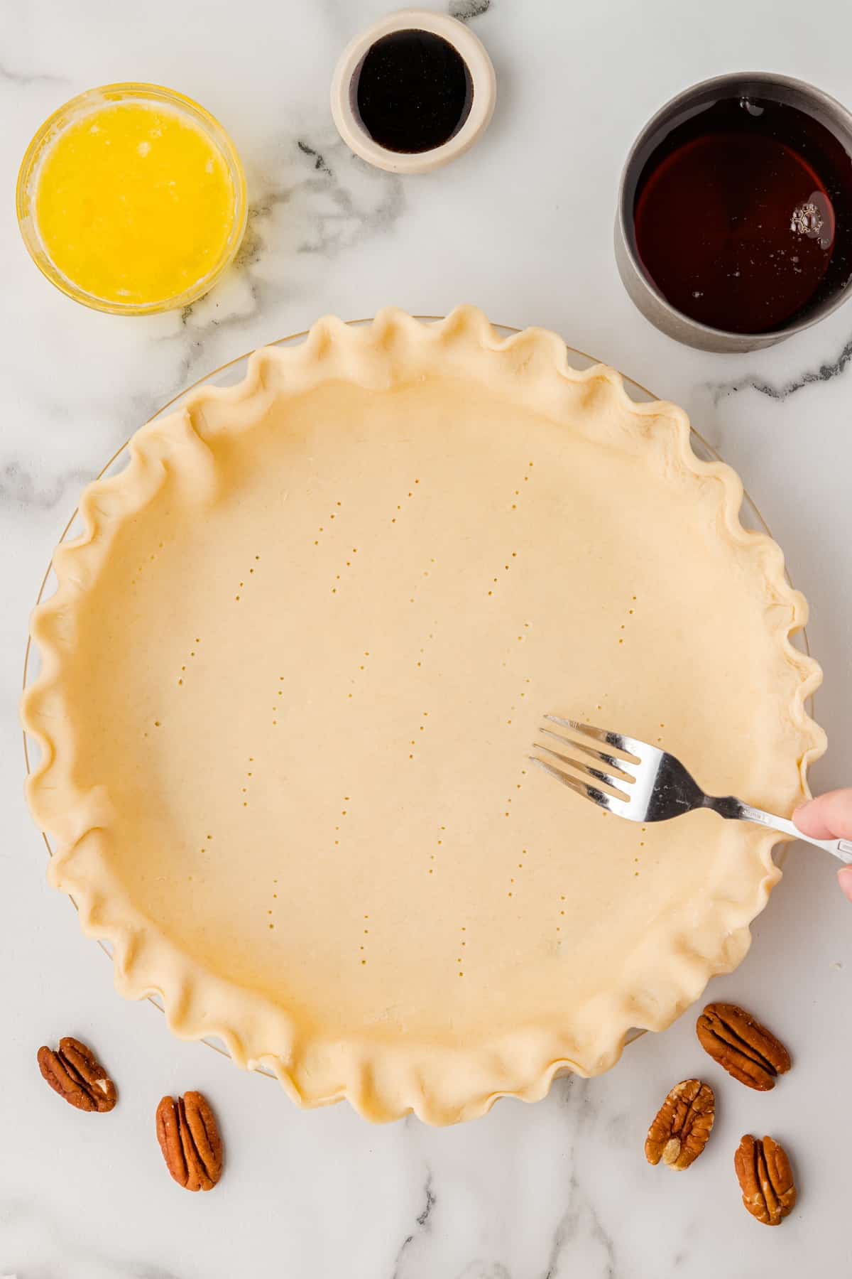prick the unbaked pie crust with a fork