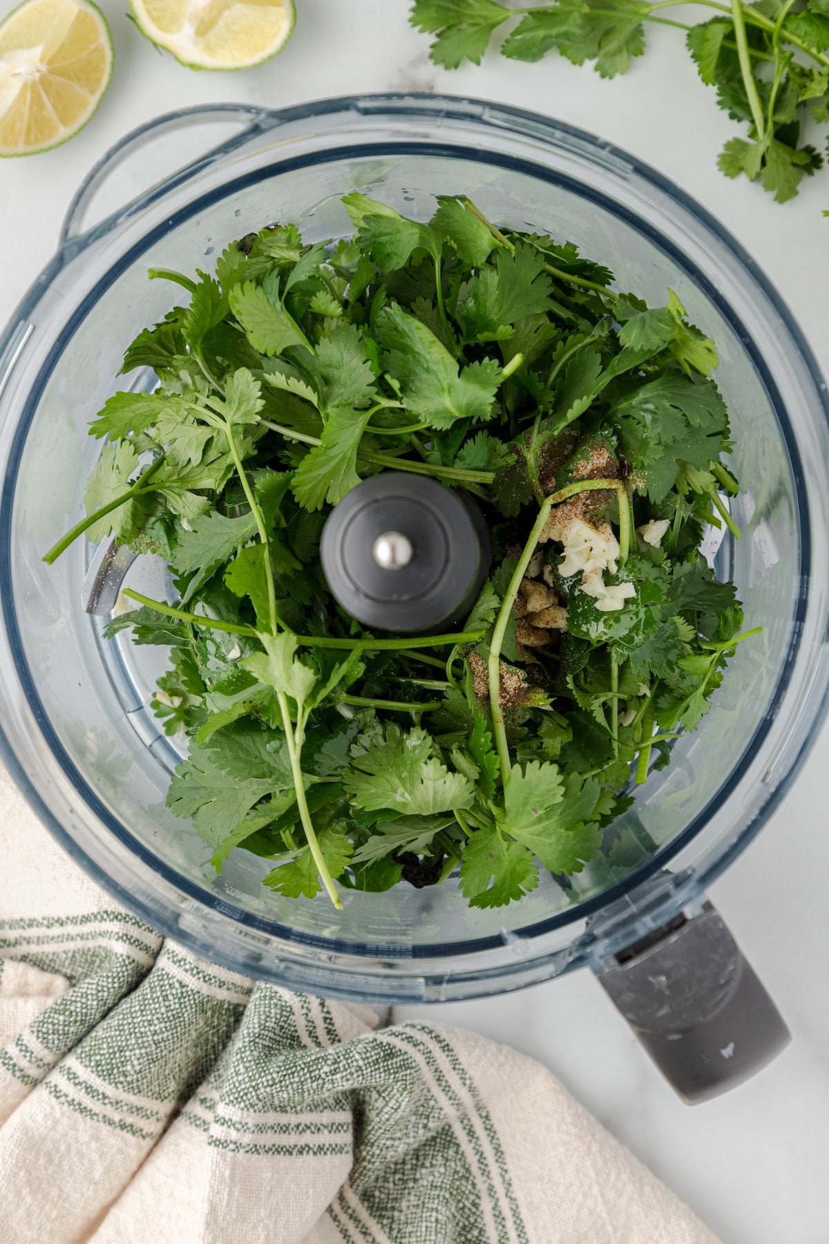 cilantro and other ingredients in a food processor