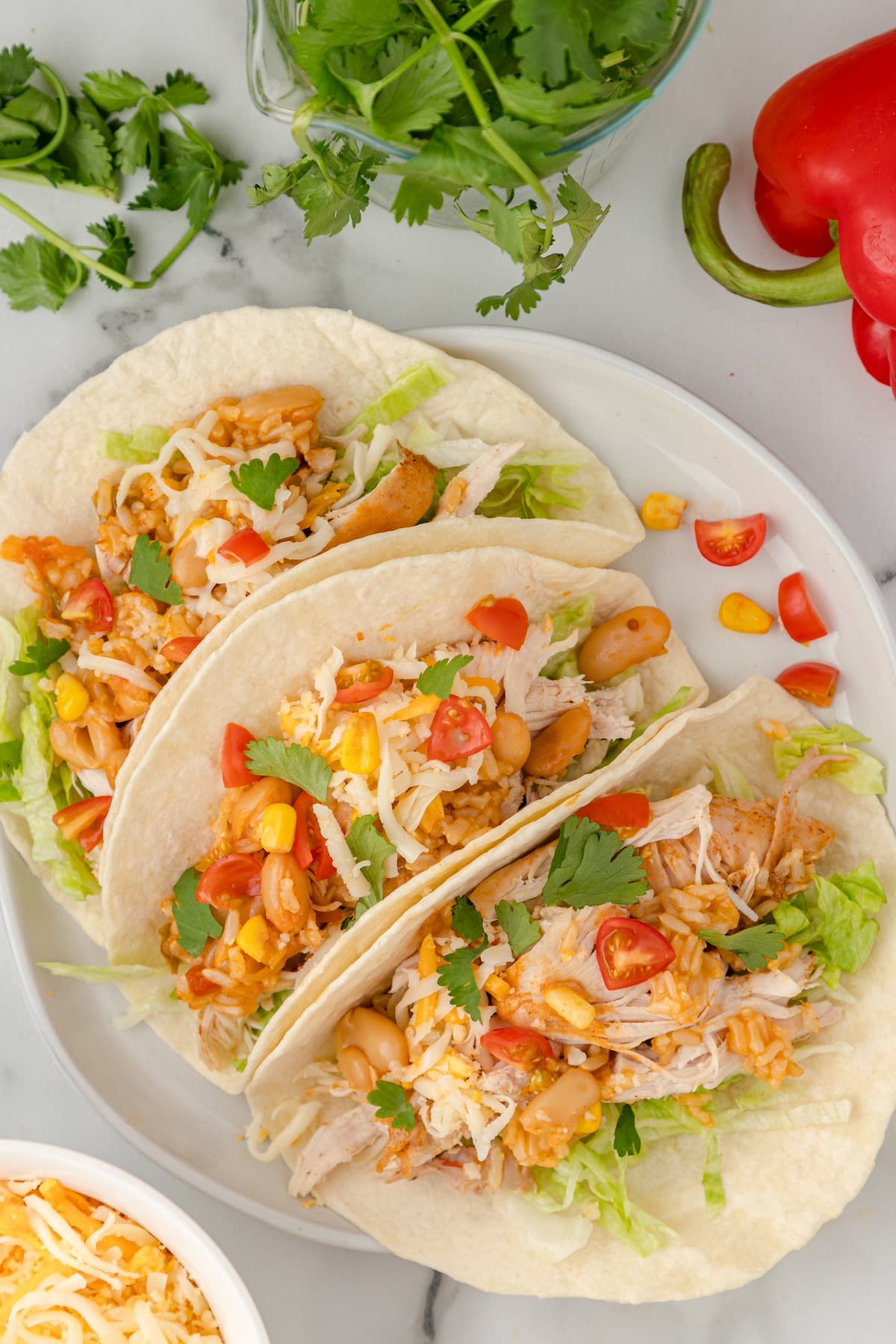 three loaded tacos made with Instant Pot shredded chicken