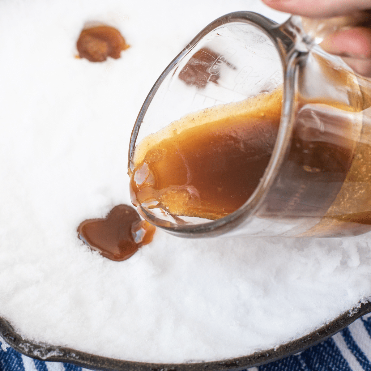 pouring maple snow candy 