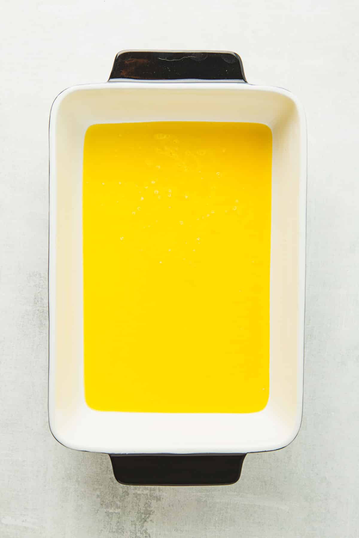 pour the melted butter into a 9x13 baking dish