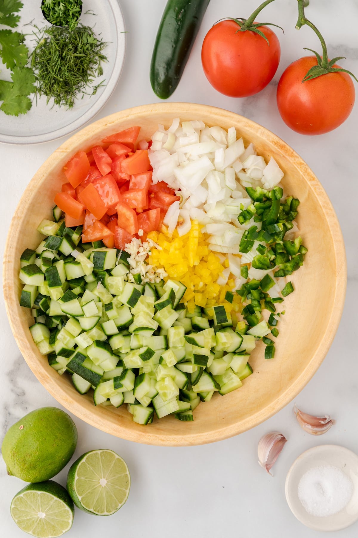 chop all the cucumber salsa ingredients and place them in a large bowl