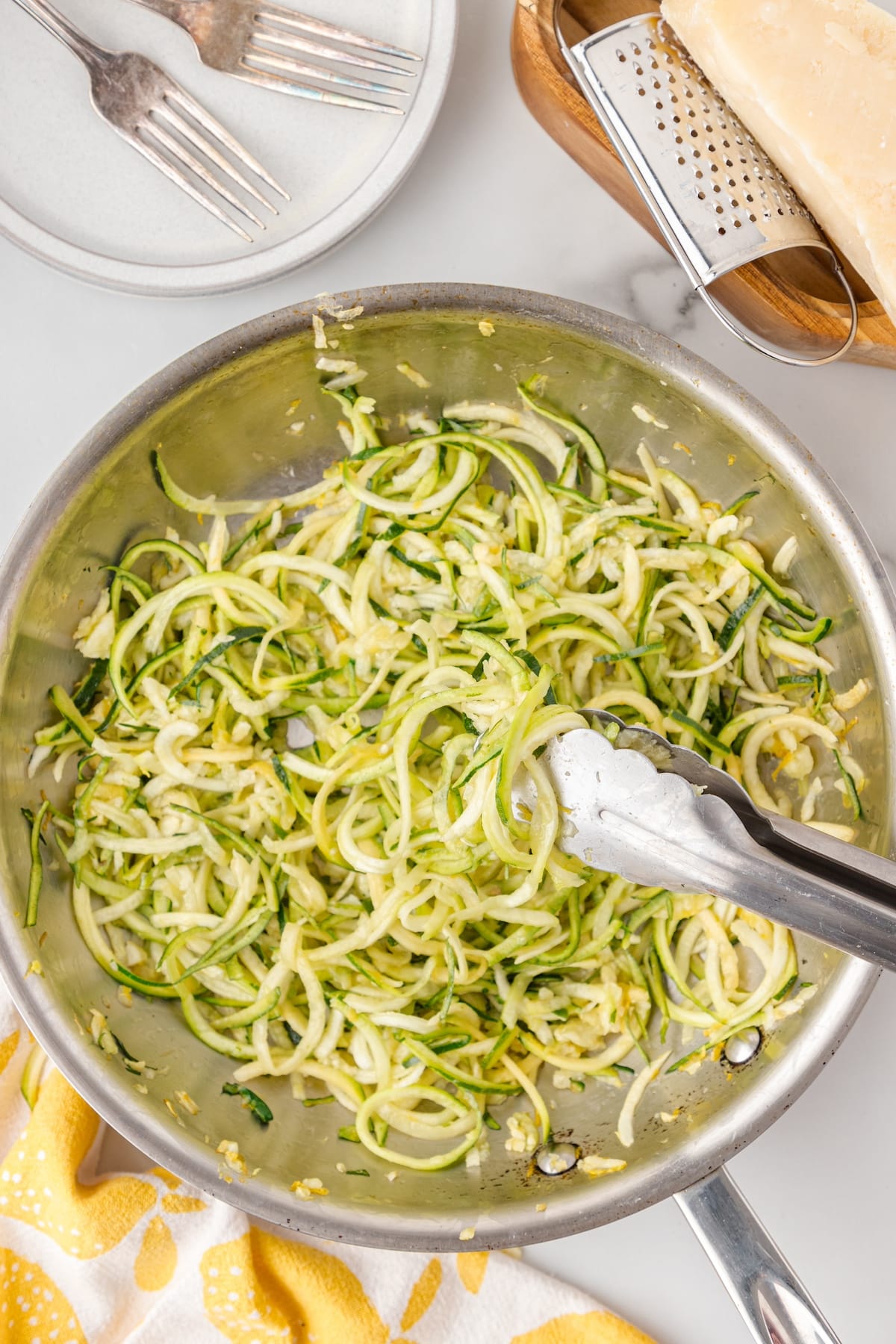 add the zucchini noodles to the skillet and saute