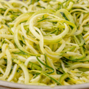 a close up of lemon zucchini noodles