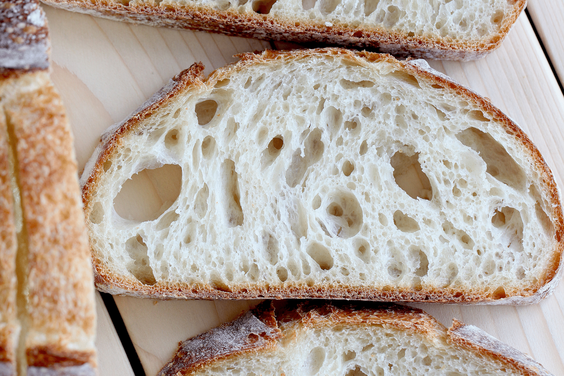 a close up of one slice of olive oil sourdough bread