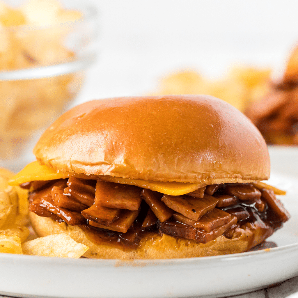 one Pittsburgh-style BBQ ham sandwich on a white plate