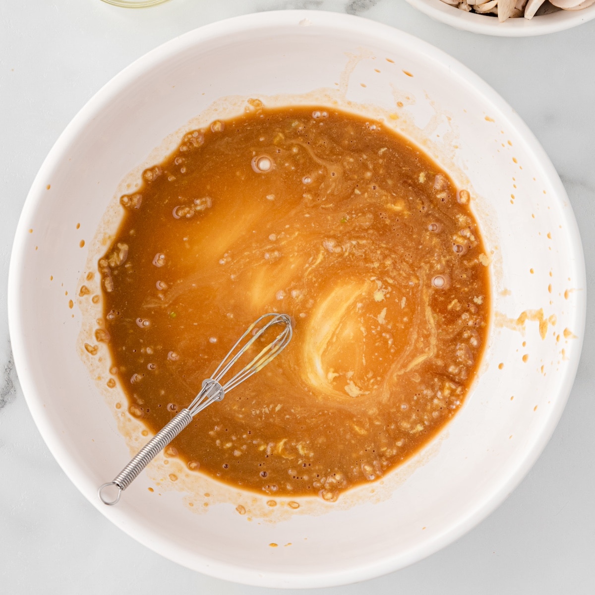 balsamic chicken marinade in a white bowl