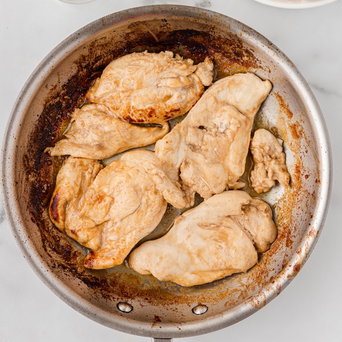 sauté the chicken breasts in the hot skillet