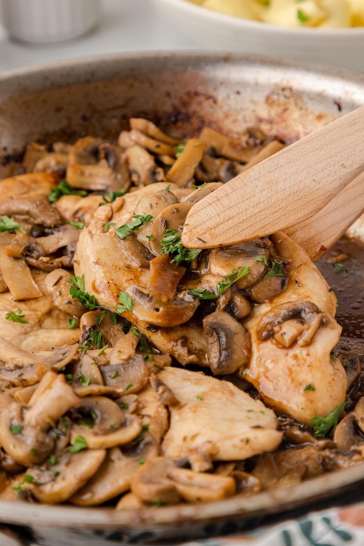 one balsamic chicken breast with mushrooms in a skillet