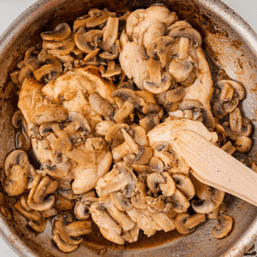 a skillet full of balsamic chicken and mushrooms