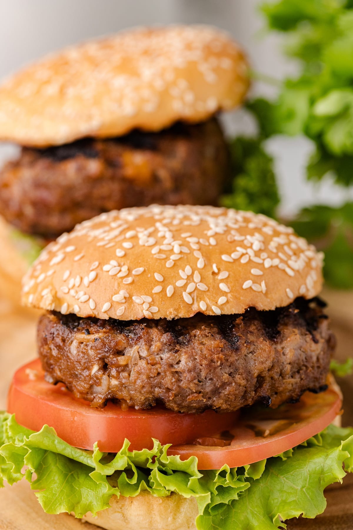 two of the best BBQ burger on a sesame seed bun with lettuce and tomato