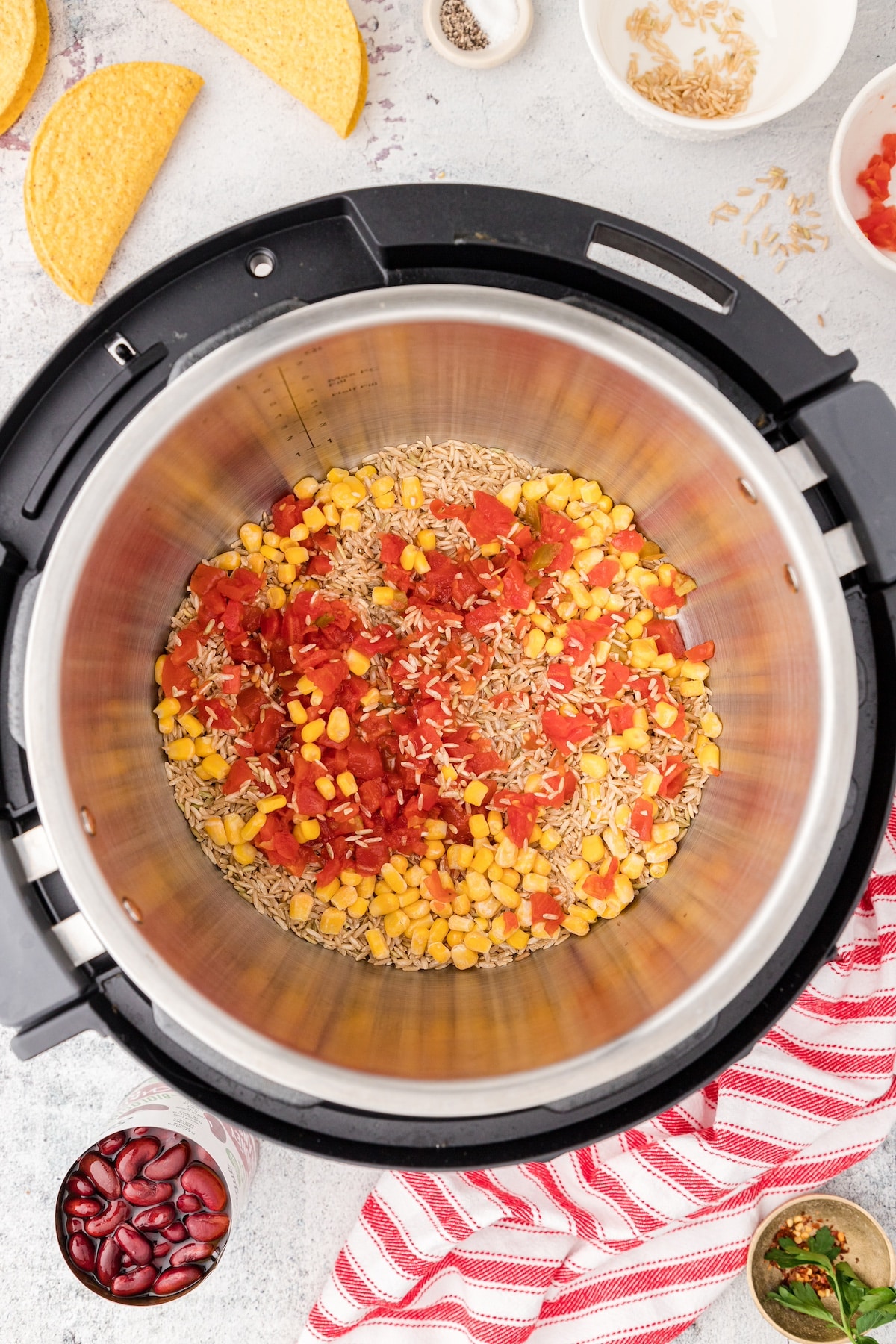 add the rice, tomatoes, and corn to the Instant Pot