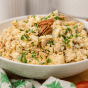 leftover rotisserie chicken and egg salad with pecans and parsley in a large white bowl