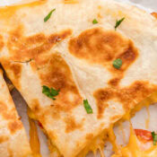 a close up of one wedge of a chicken bacon ranch quesadilla