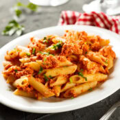 salsa chicken pasta on a white plate