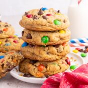 a stack of four Easy Monster Cookies with M&Ms, chocolate chips, peanut butter, and oatmeal