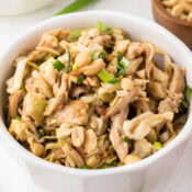 a close up of thai peanut chicken salad with peanut butter soy sauce salad dressing