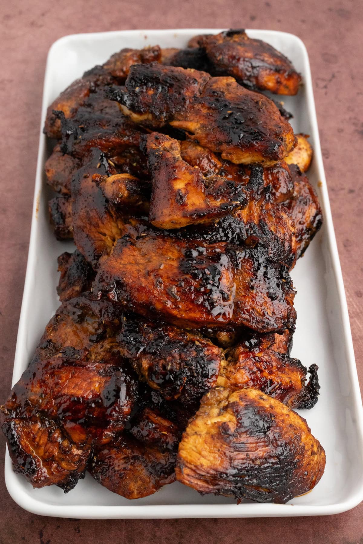 a close up of balsamic chicken that has been marinated with balsamic vinegar and herbs