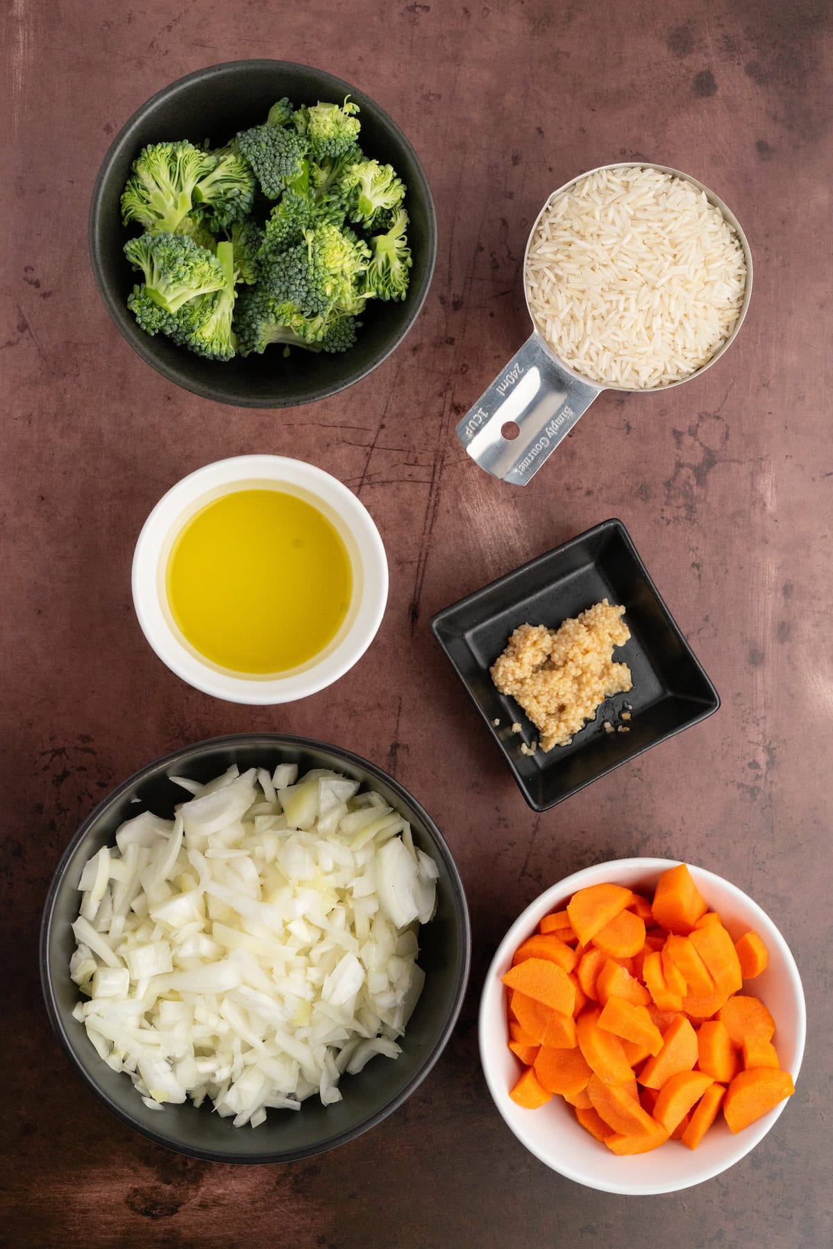 Balsamic Chicken and Veggies ingredients including onions, broccoli, carrots, and rice