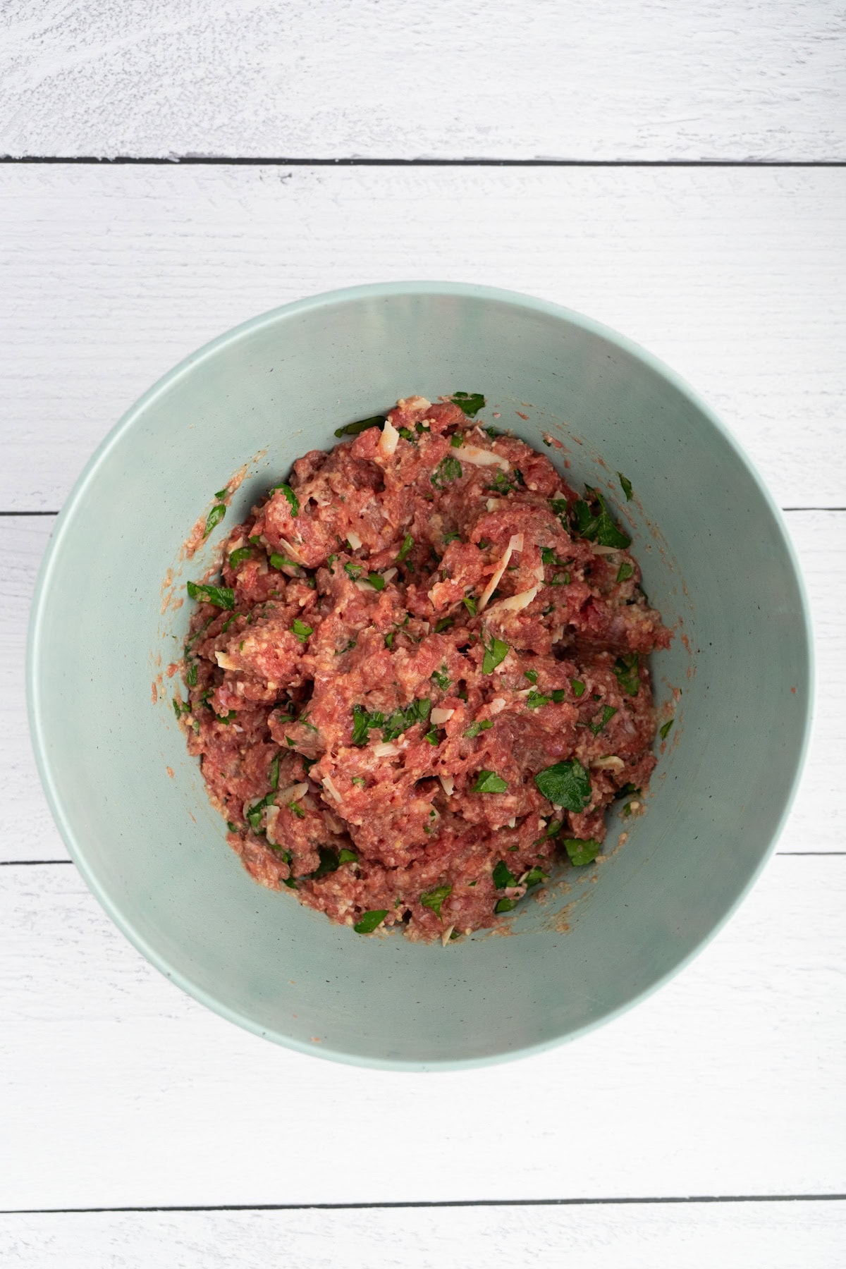 mix the ground beef and the rest of the ingredients into the breadcrumb and milk slurry