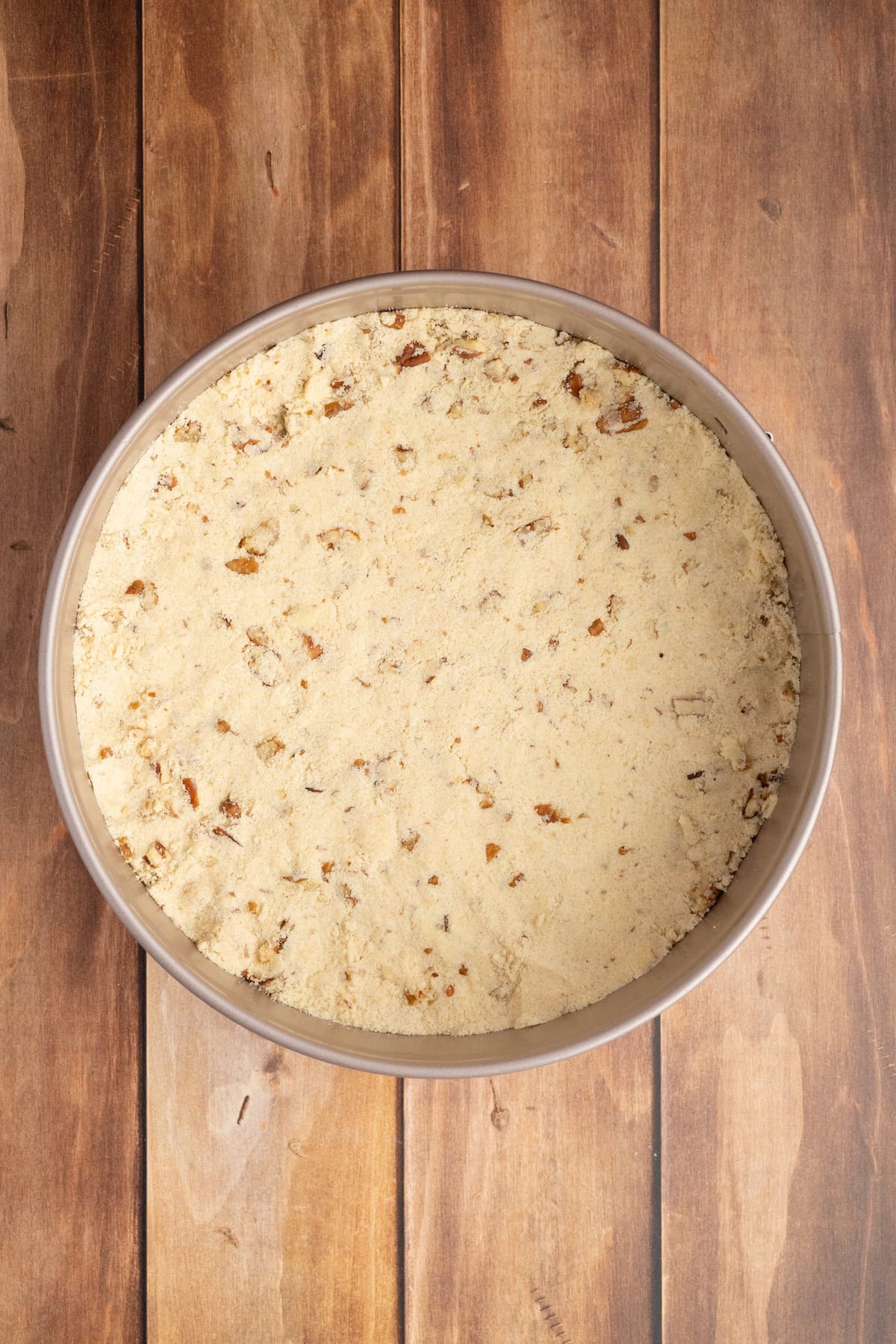 press the gluten free cheesecake crust into the springform pan