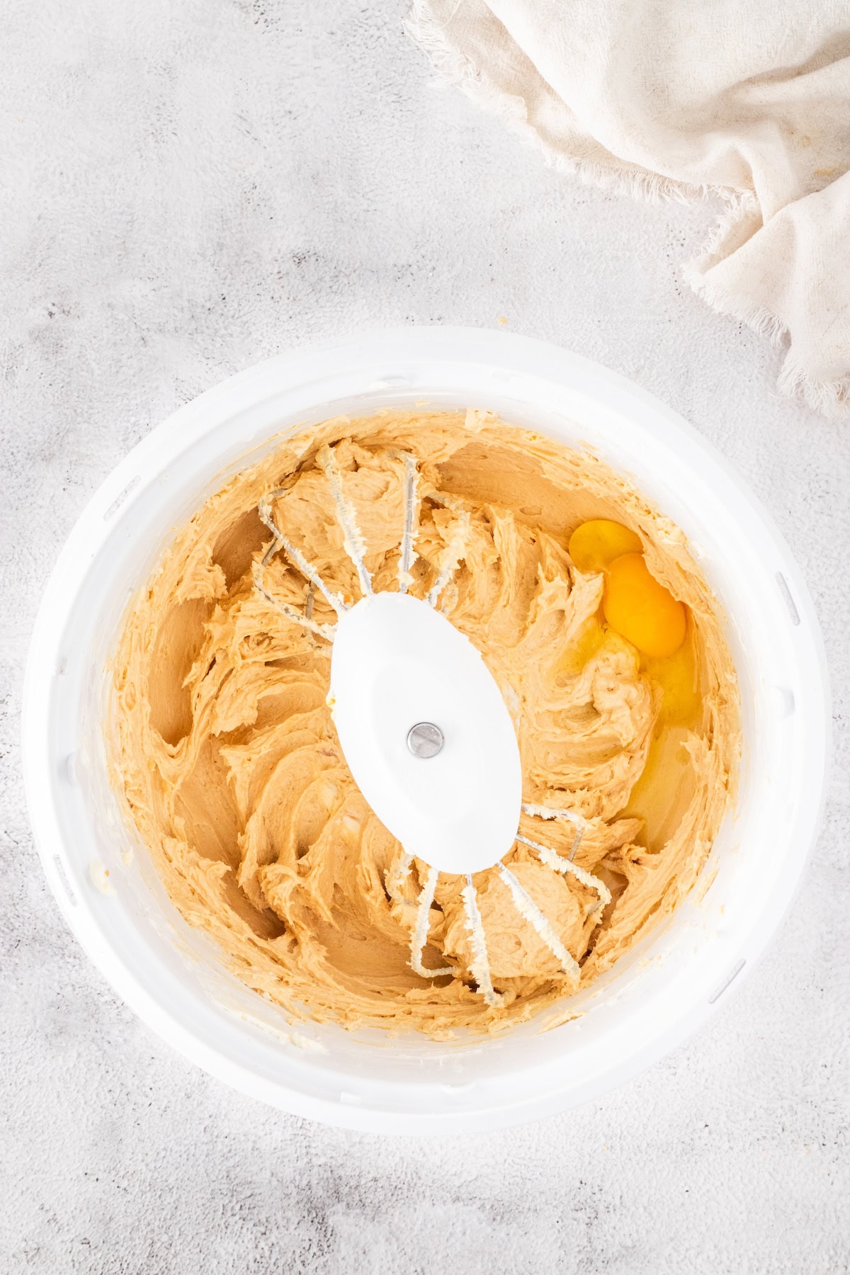 add the eggs to the peanut butter cheesecake filling