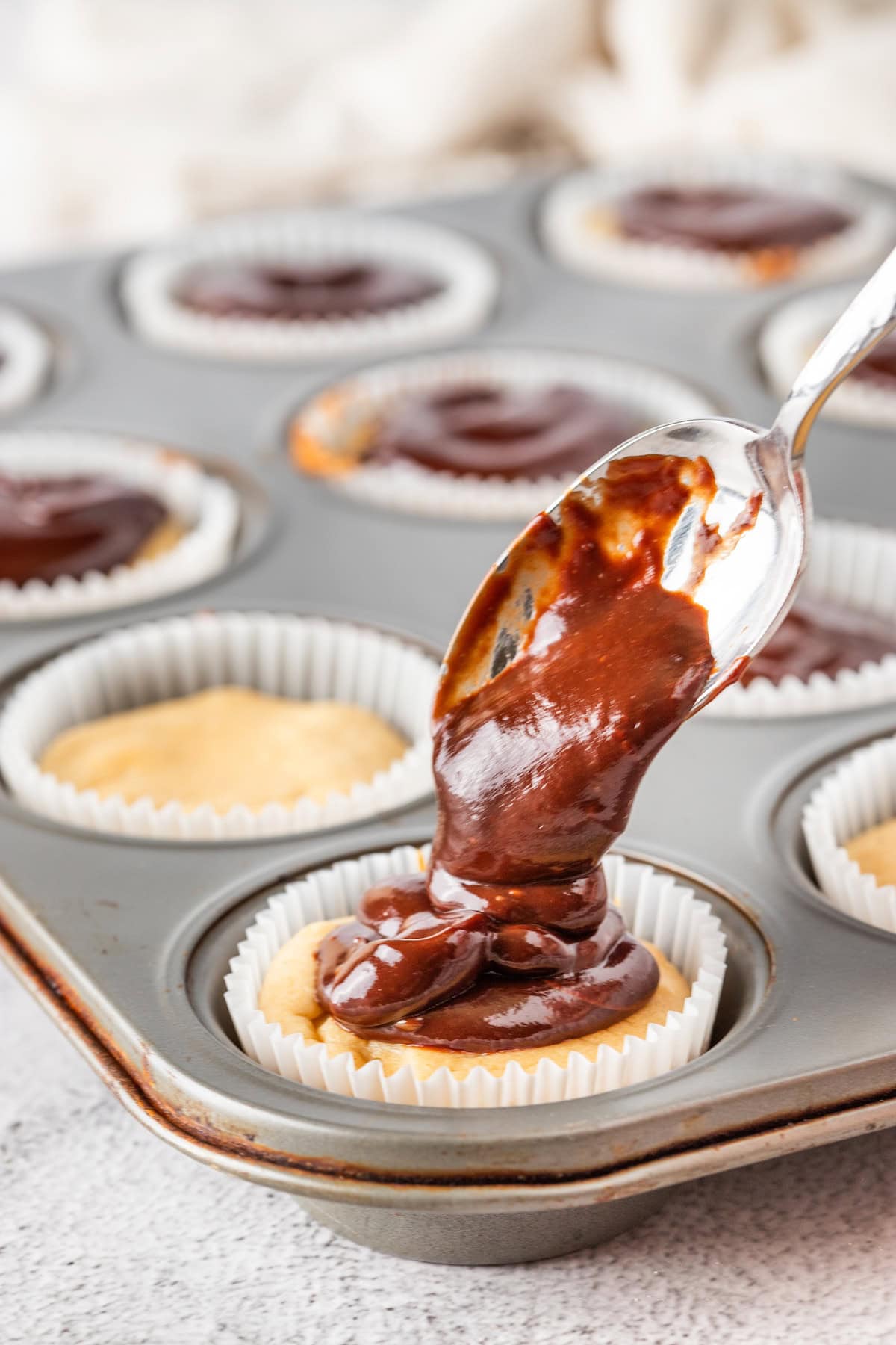cover each mini cheesecake with chocolate ganache