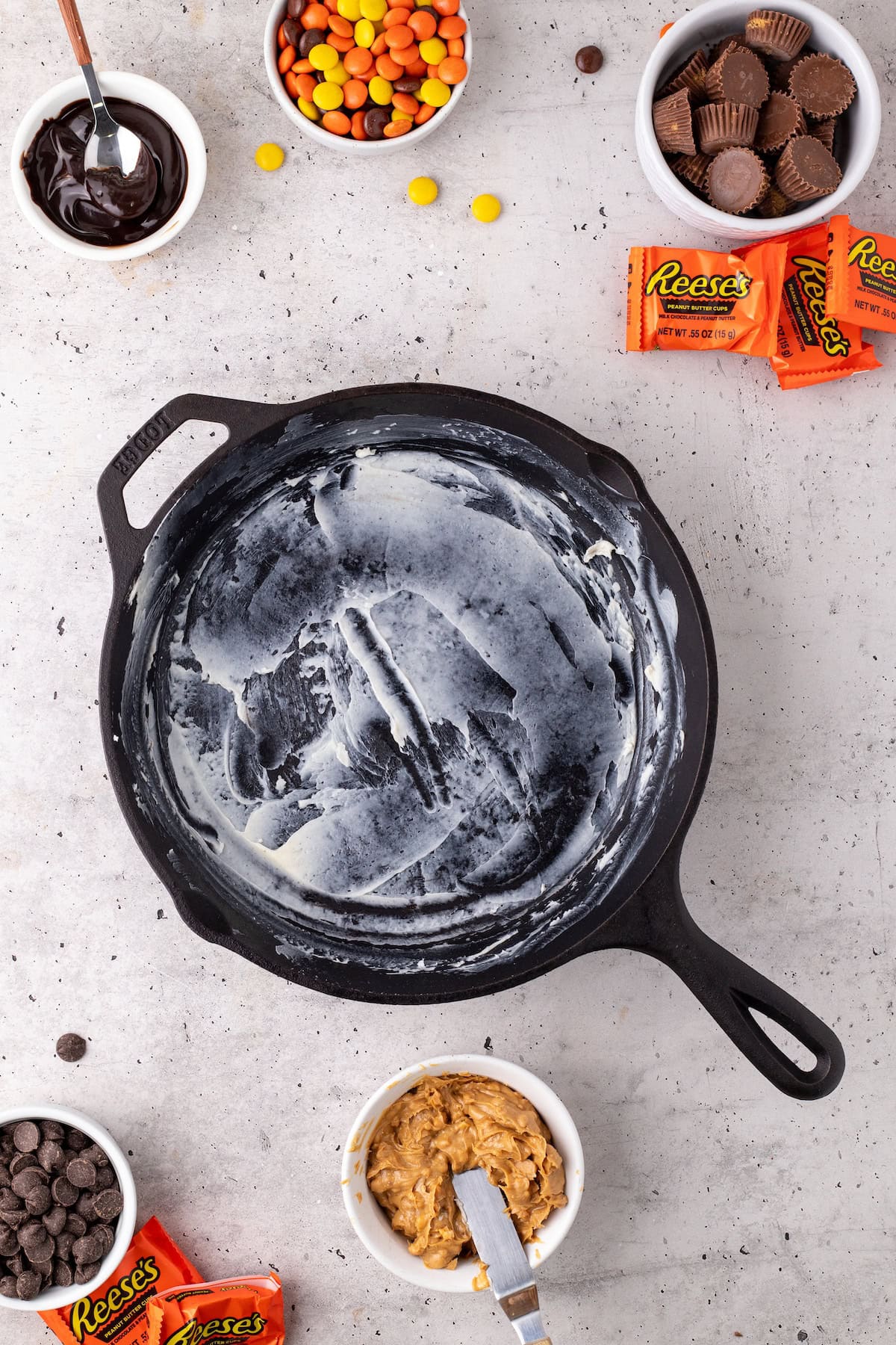 grease the cast iron skillet by rubbing butter on the bottom and the sides