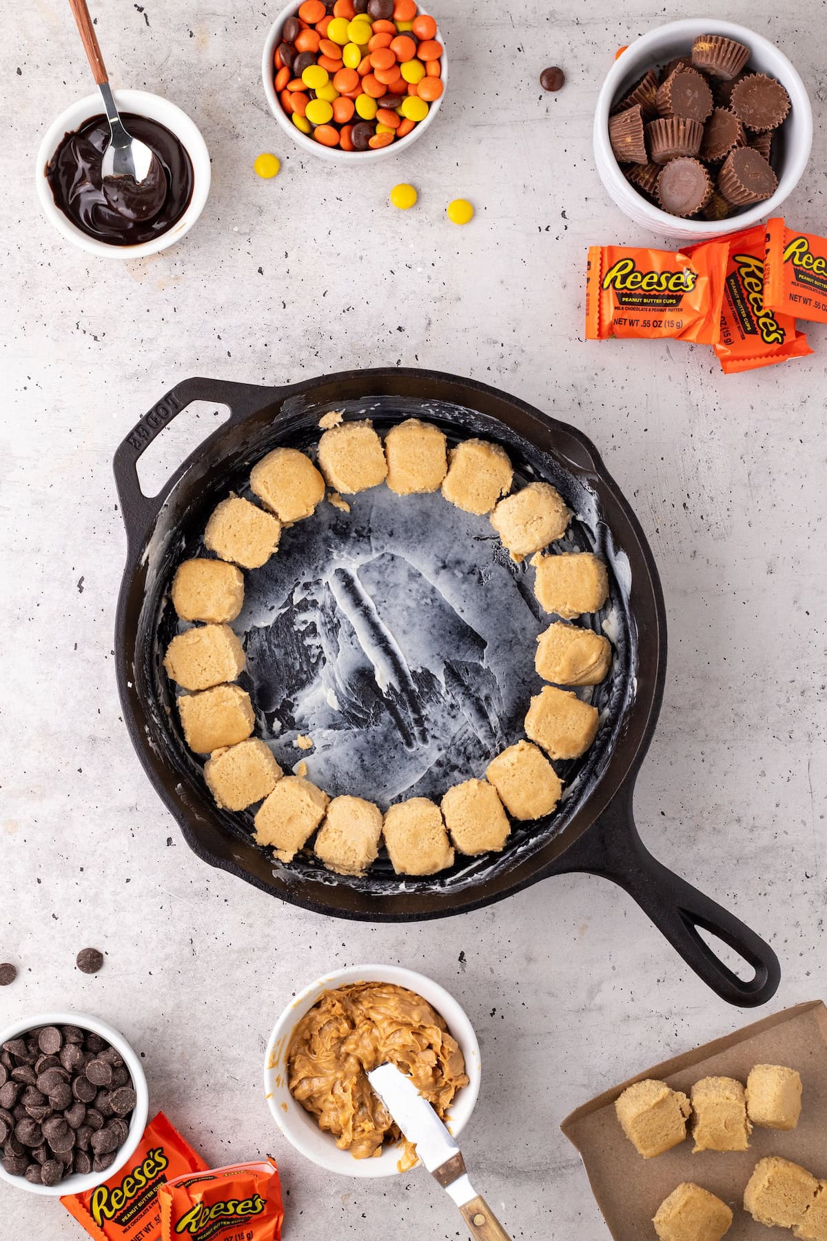 press the premade cookie dough into the bottom of the skillet