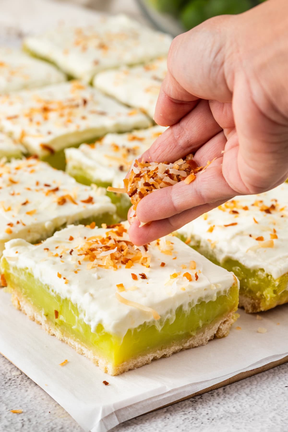 sprinkle the key lime pie bars with toasted coconut