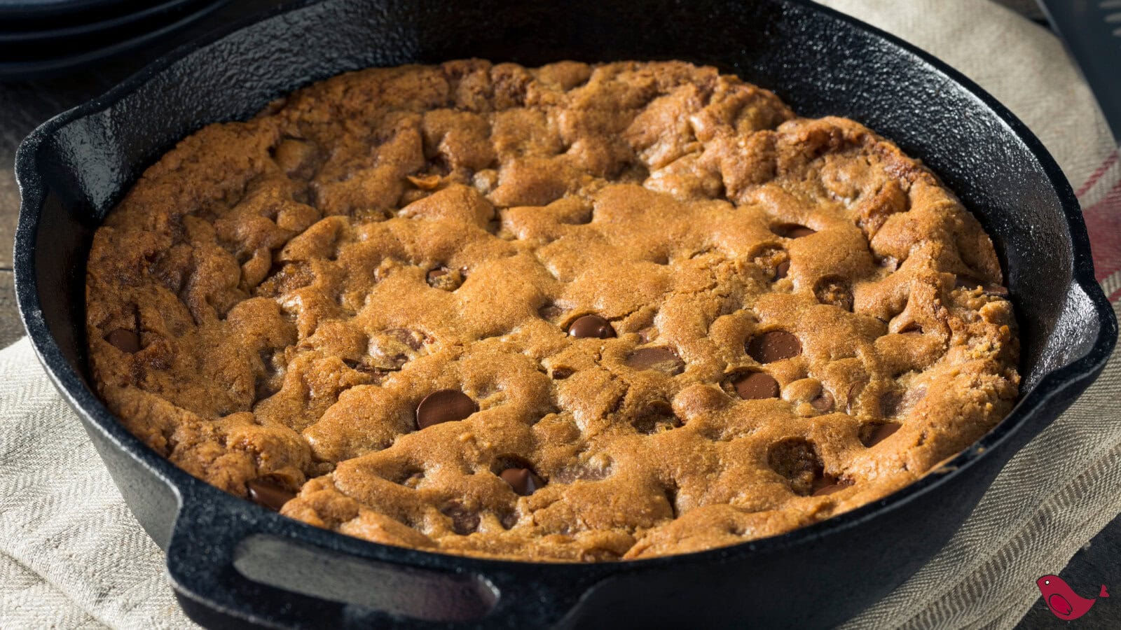 Peanut Butter stuffed Chocolate Chip Skillet Cookie in a cast iron skillet