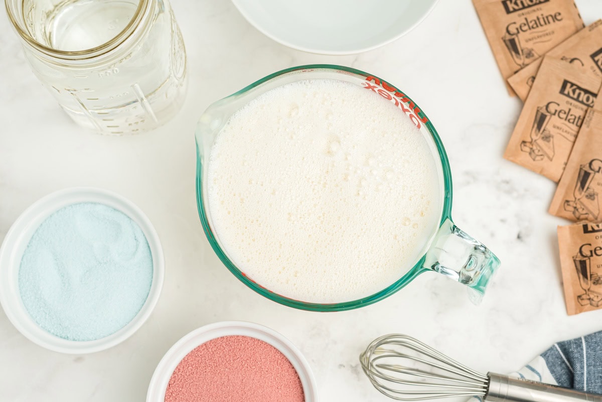whisk the unflavored gelatin with condensed milk and boiling water