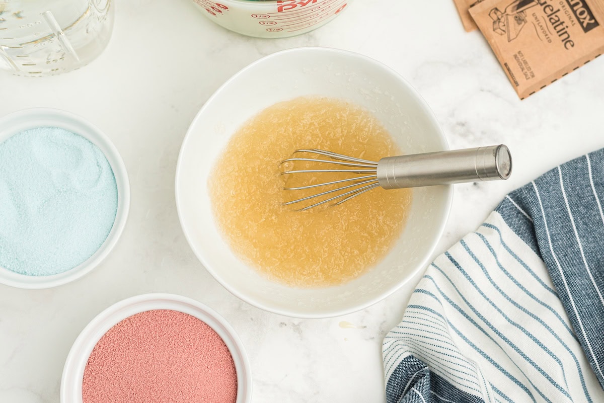 whisk together the unflavored gelatin with boiling water
