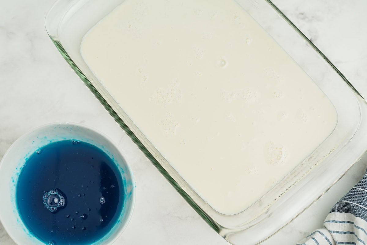 pour the condensed milk layer on top of the grape jello