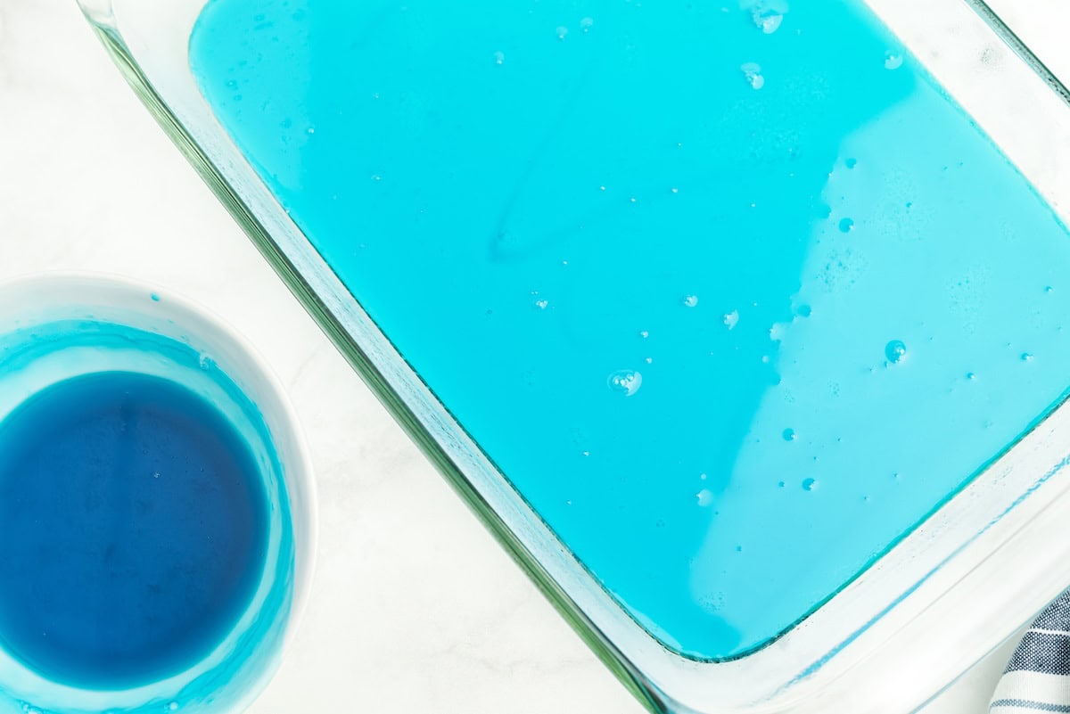 pour the blue jello over the cooled condensed milk layer