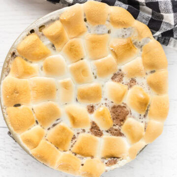 s'mores cheesecake topped with toasted marshmallows