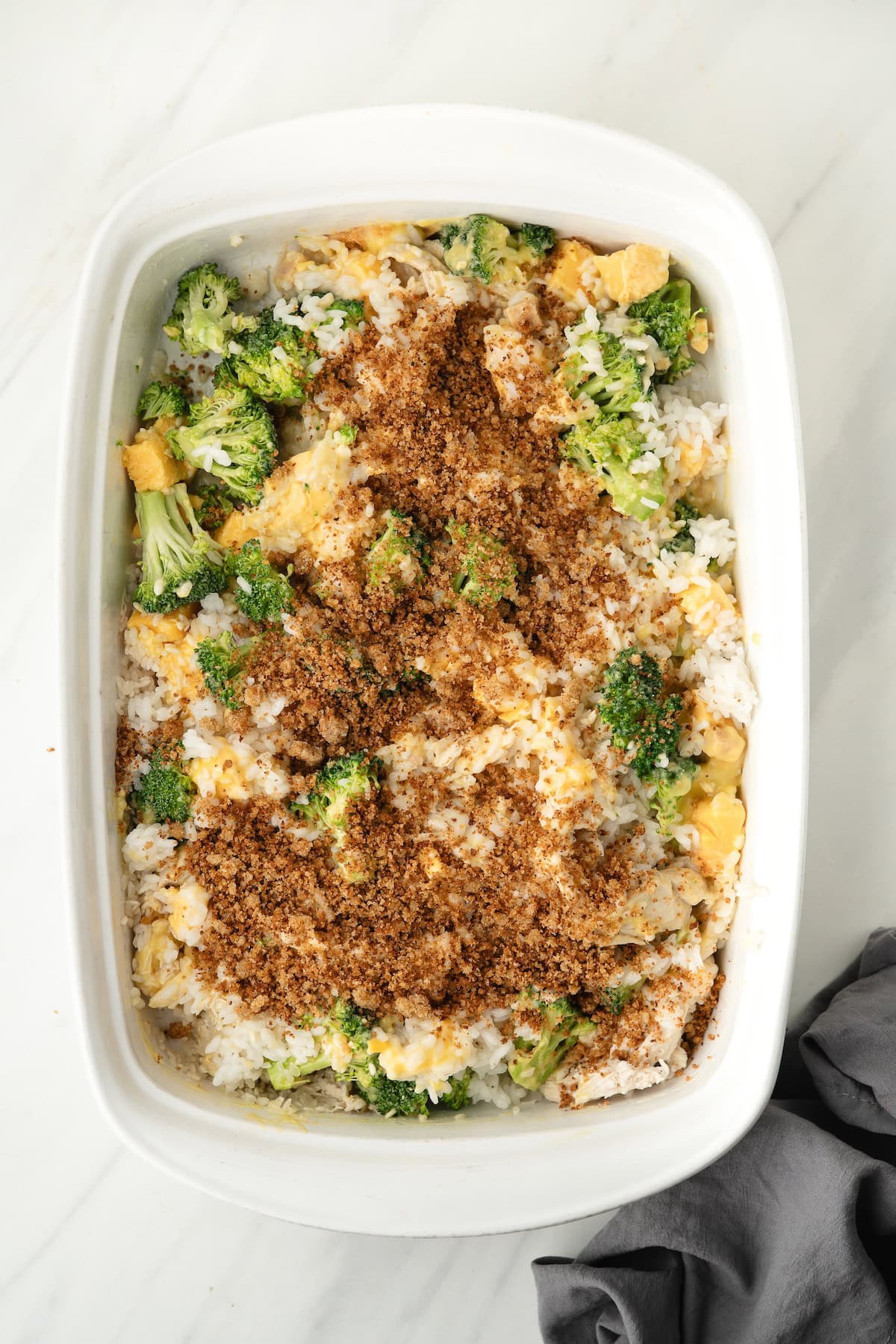 sprinkle the breadcrumbs over top of the Chicken Broccoli Rice and Cheese mixture