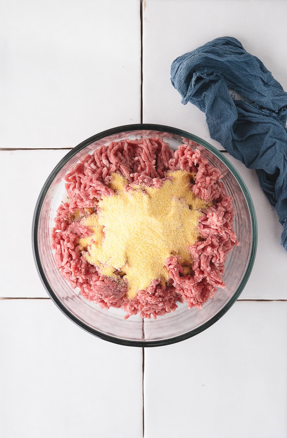 add cornmeal to the ground beef