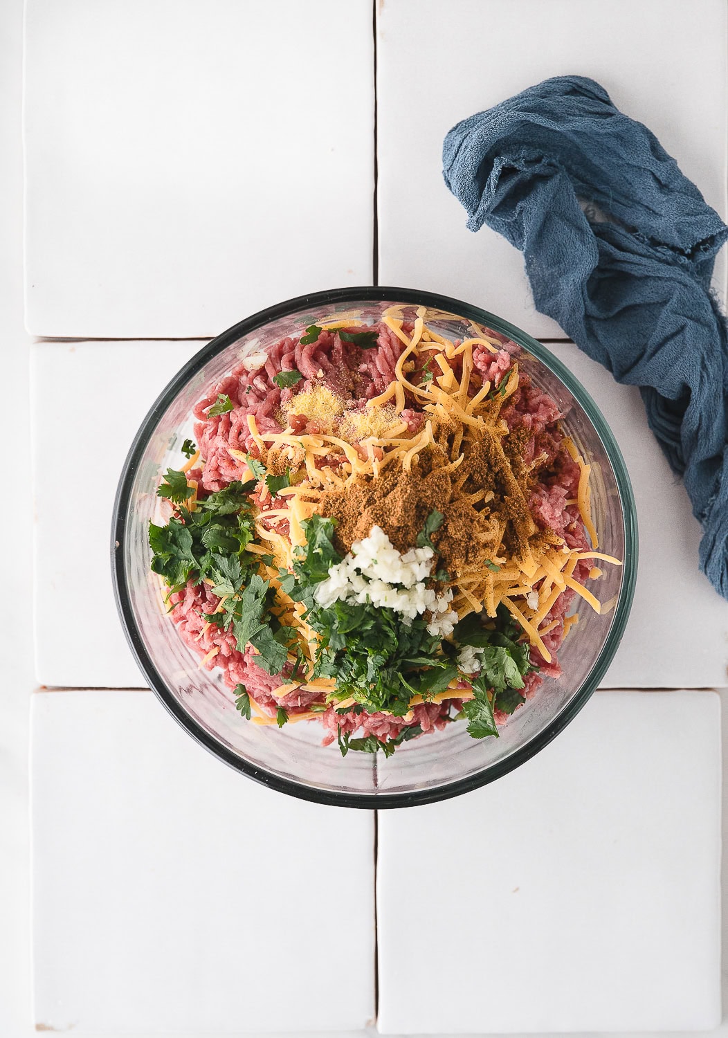 add the cilantro and garlic to the taco burger mixture