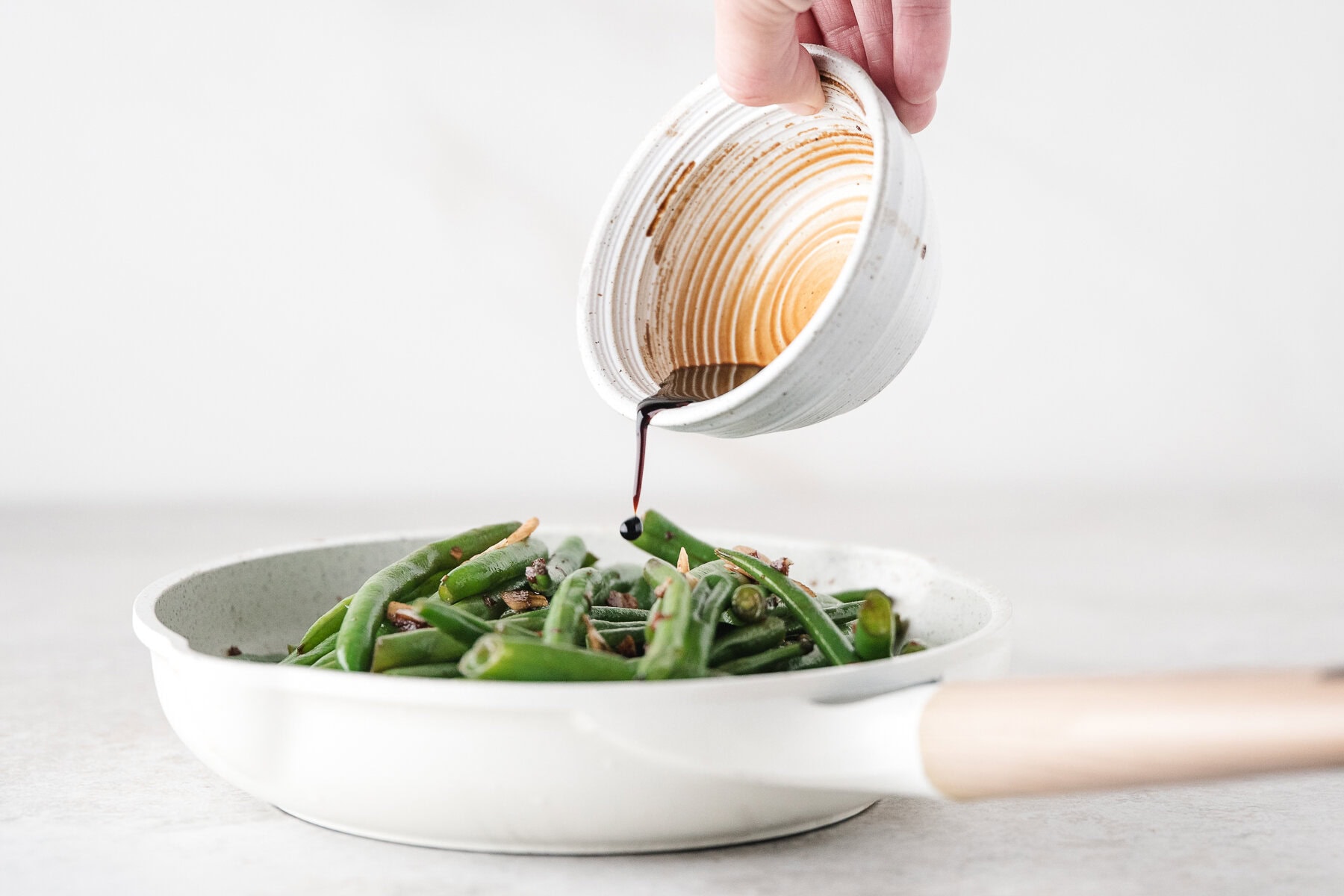 pour the soy sauce mixture over the green beans