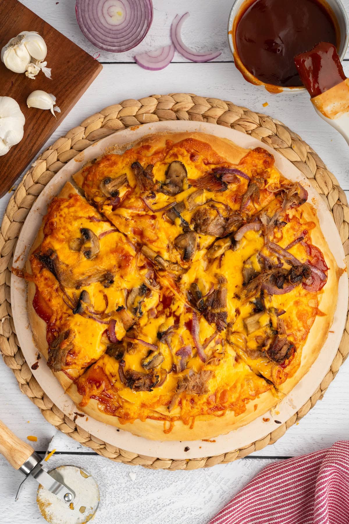 BBQ Pulled Pork Pizza cut into 4 wedges