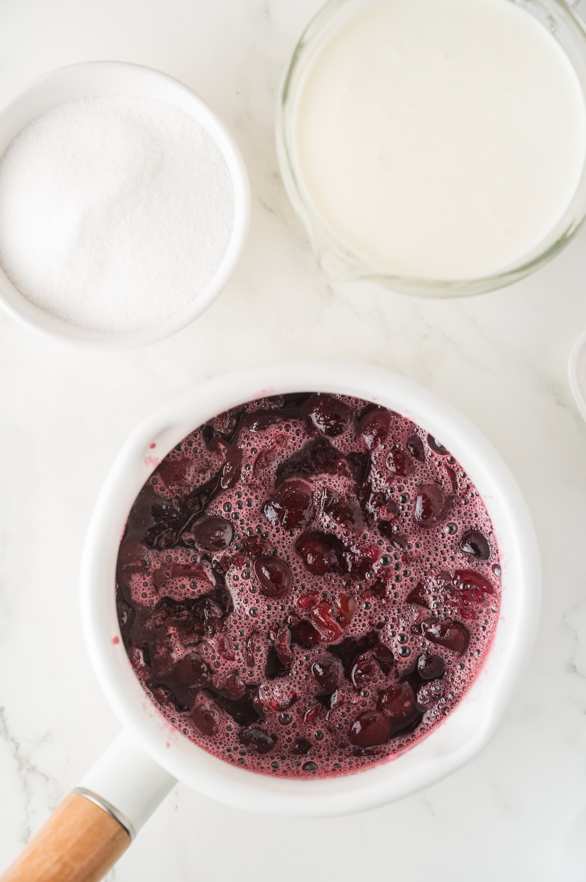 cook the cherries and sugar until the cherries have mostly broken down