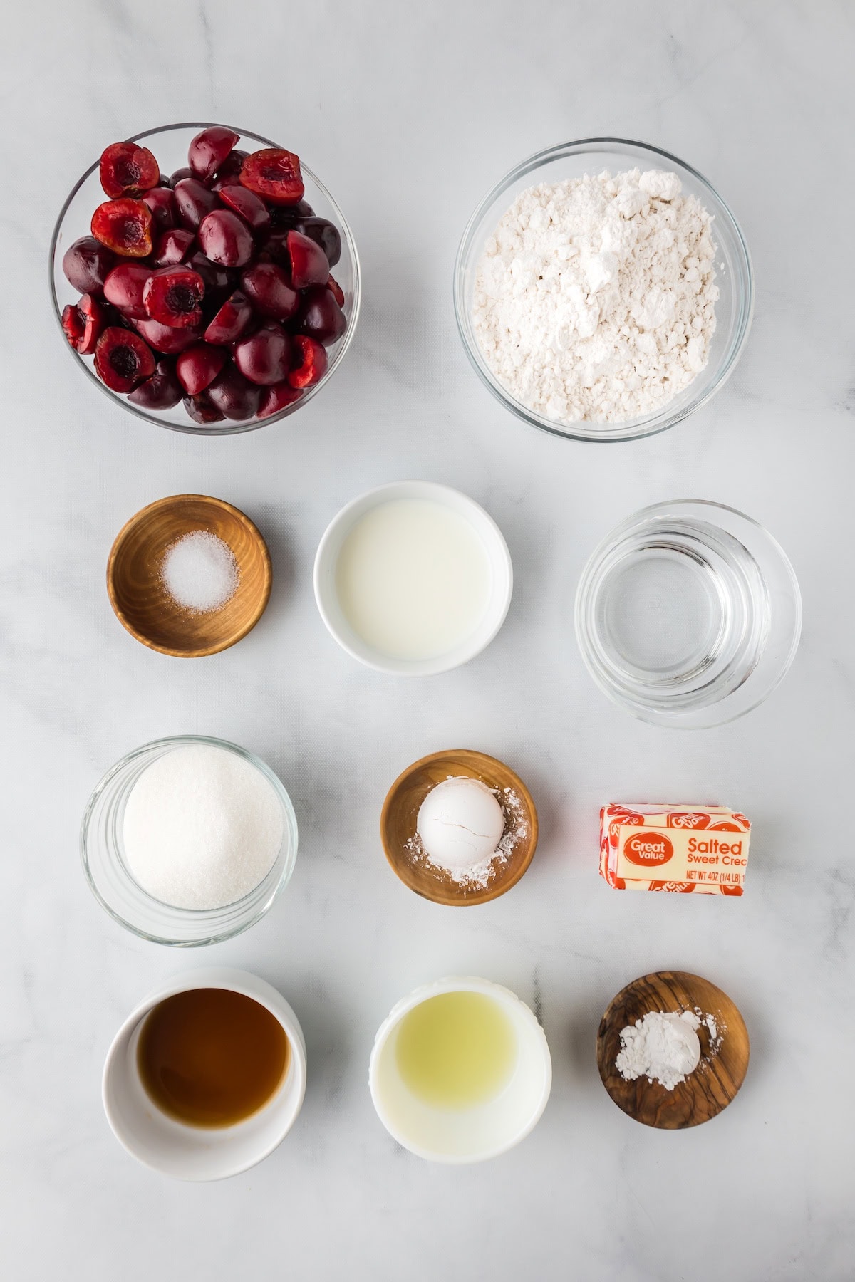 easy cherry cobbler ingredients including fresh cherries, flour, sugar, and vanilla