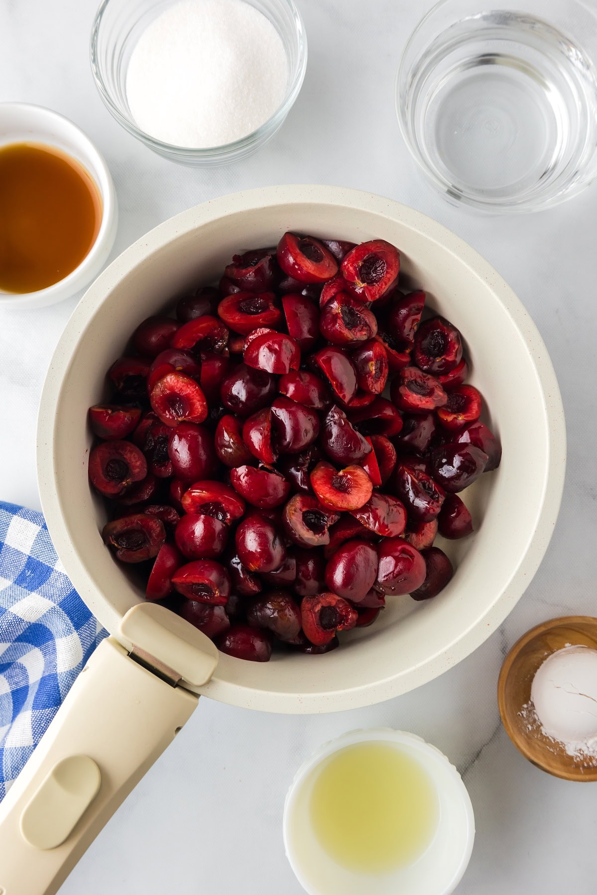 add the pitted and halved cherries to a small saucepan