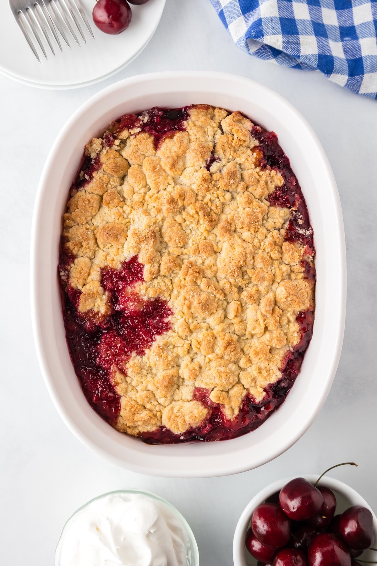 easy cherry cobbler with fresh cherries and a golden crust just after baking