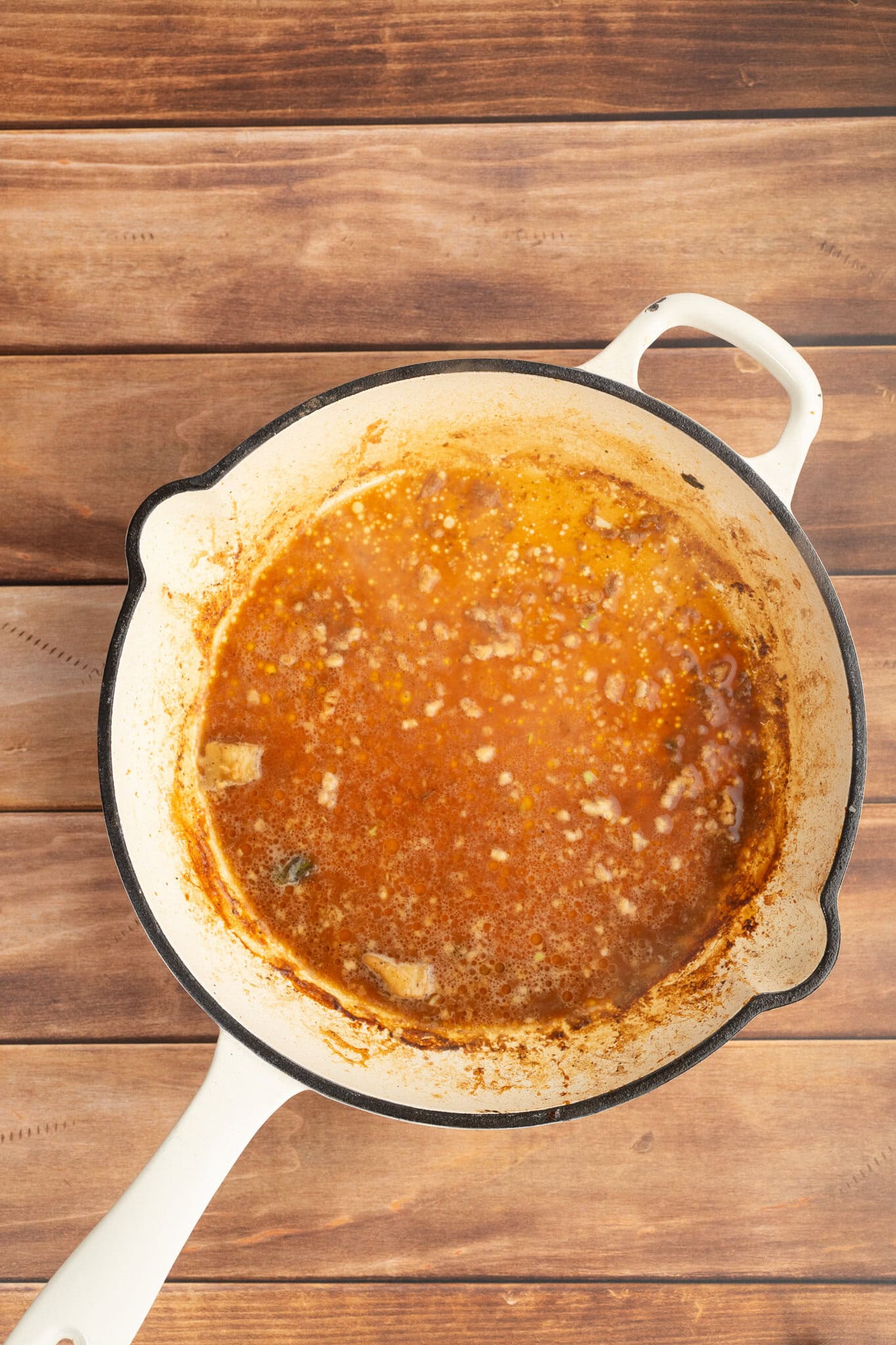 add the white wine and garlic to deglaze the skillet