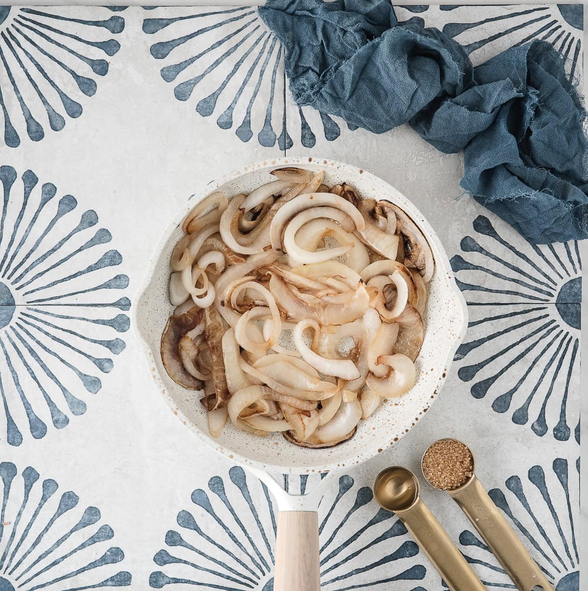when the onions are mostly cooked, add water and brown sugar to fully caramelize them