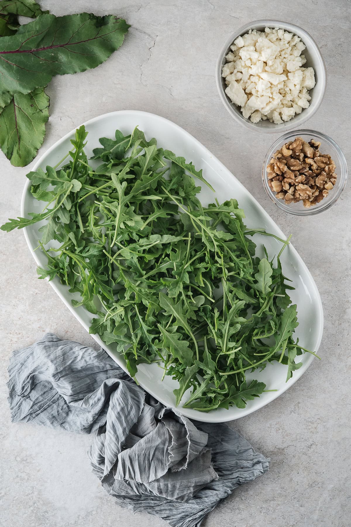 spread the fresh arugula on a platter