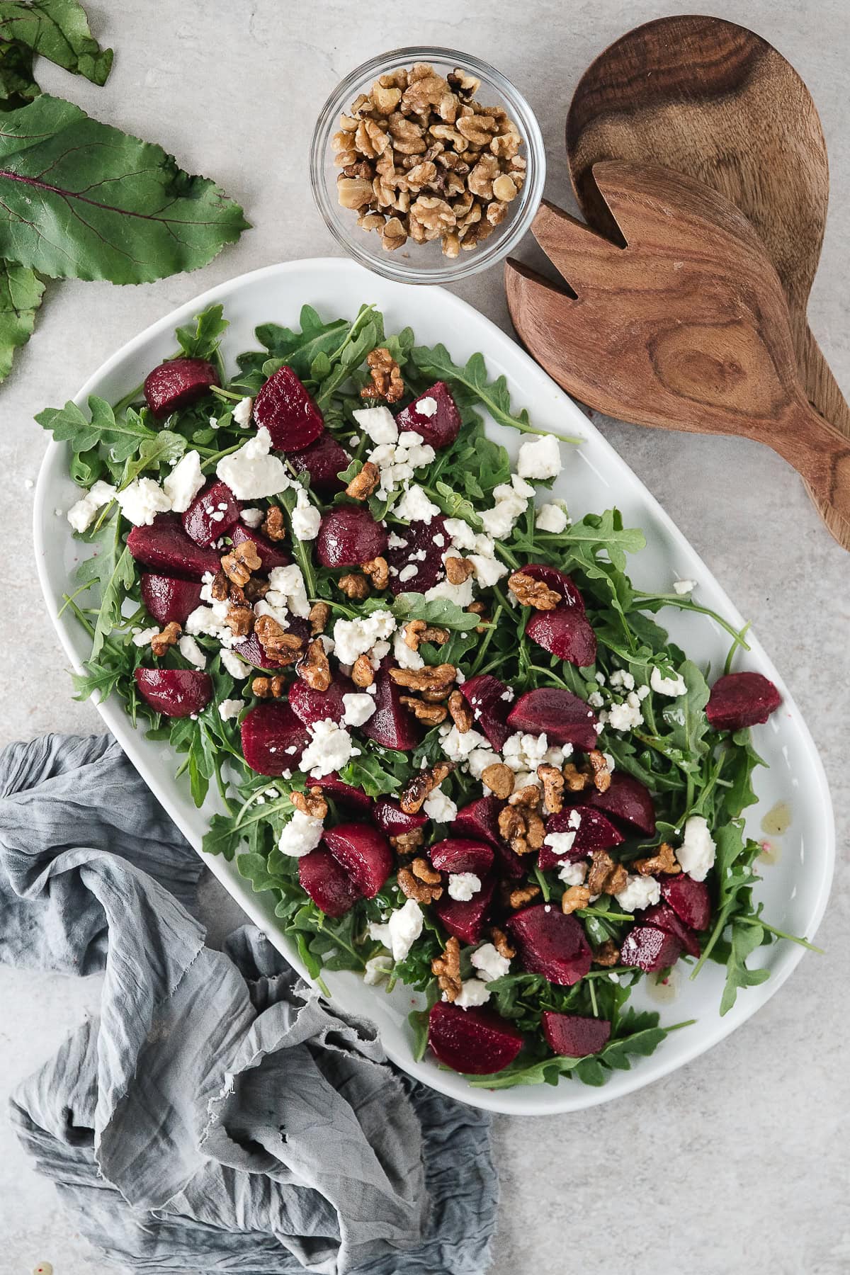 sprinkle the feta and candied walnuts overtop of the roasted beets and arugula